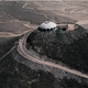 Illustration for article titled A House Shaped Like a Flying Saucer, Perched Atop a Volcano